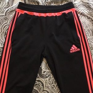 Black and neon pink adidas joggers